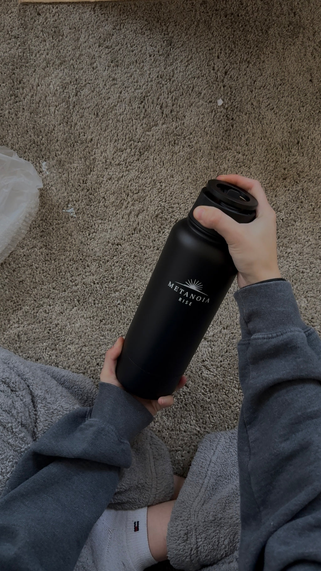 Metanoia Rise 32 oz Water Bottle with 8 oz Bottom Storage & Magnetic Phone Holder Lid