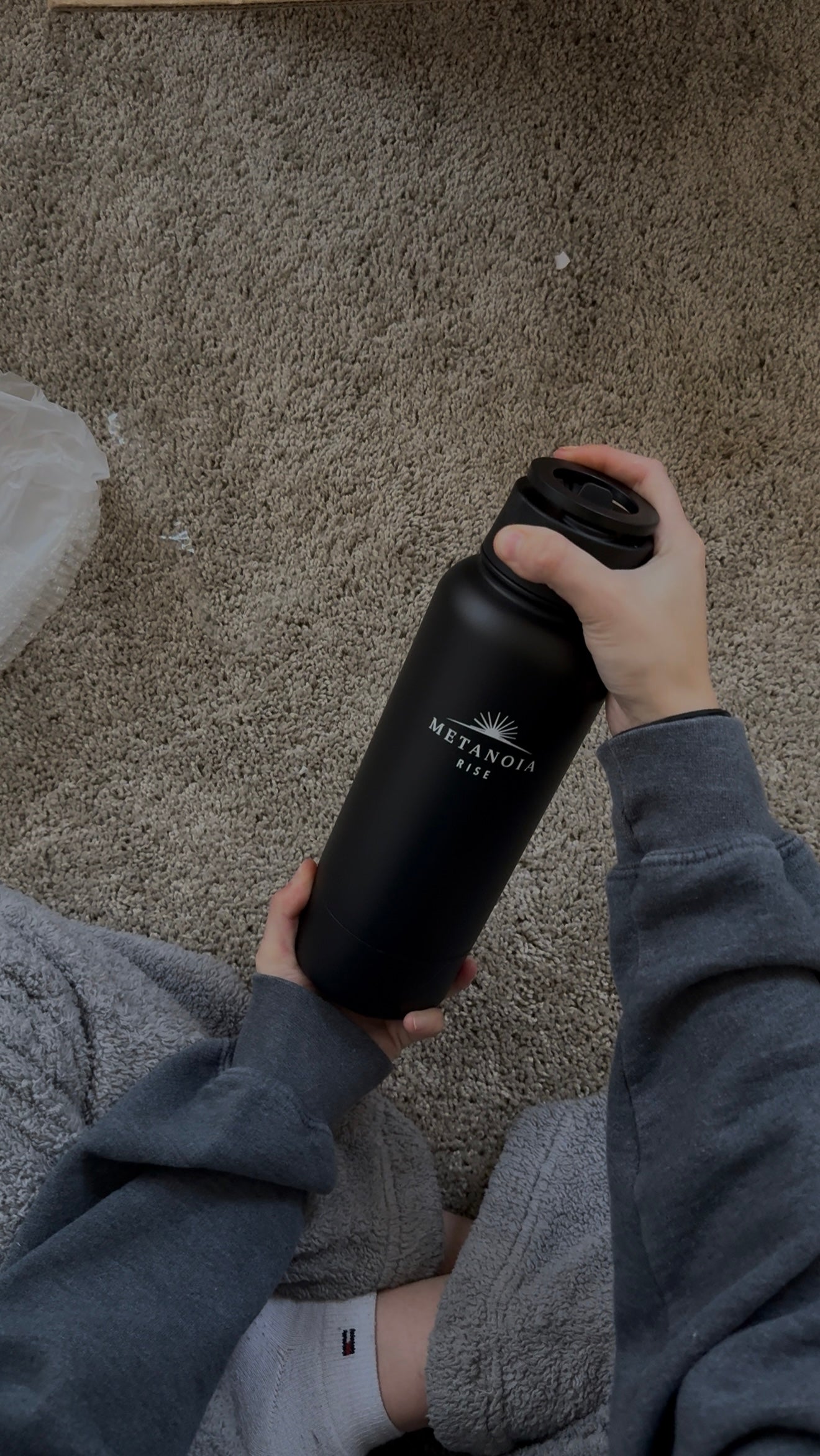 Metanoia Rise 32 oz Water Bottle with 8 oz Bottom Storage & Magnetic Phone Holder Lid